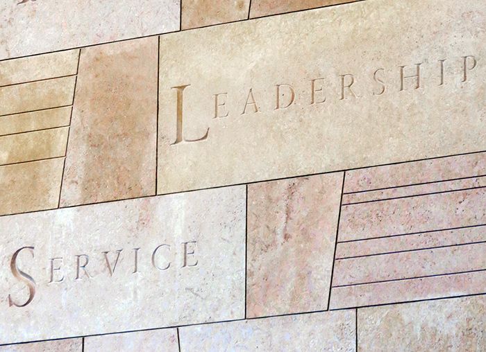 Leadership and Service engraved in stone