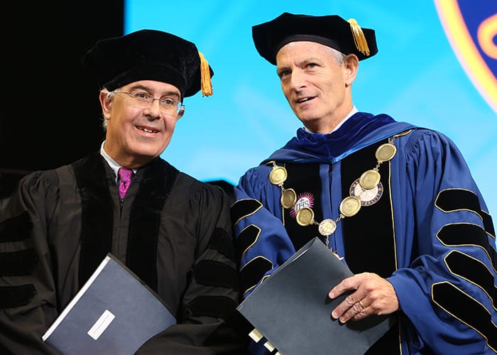 David Brooks and Marquette University President Michael R. Lovell at 2019 Commencement